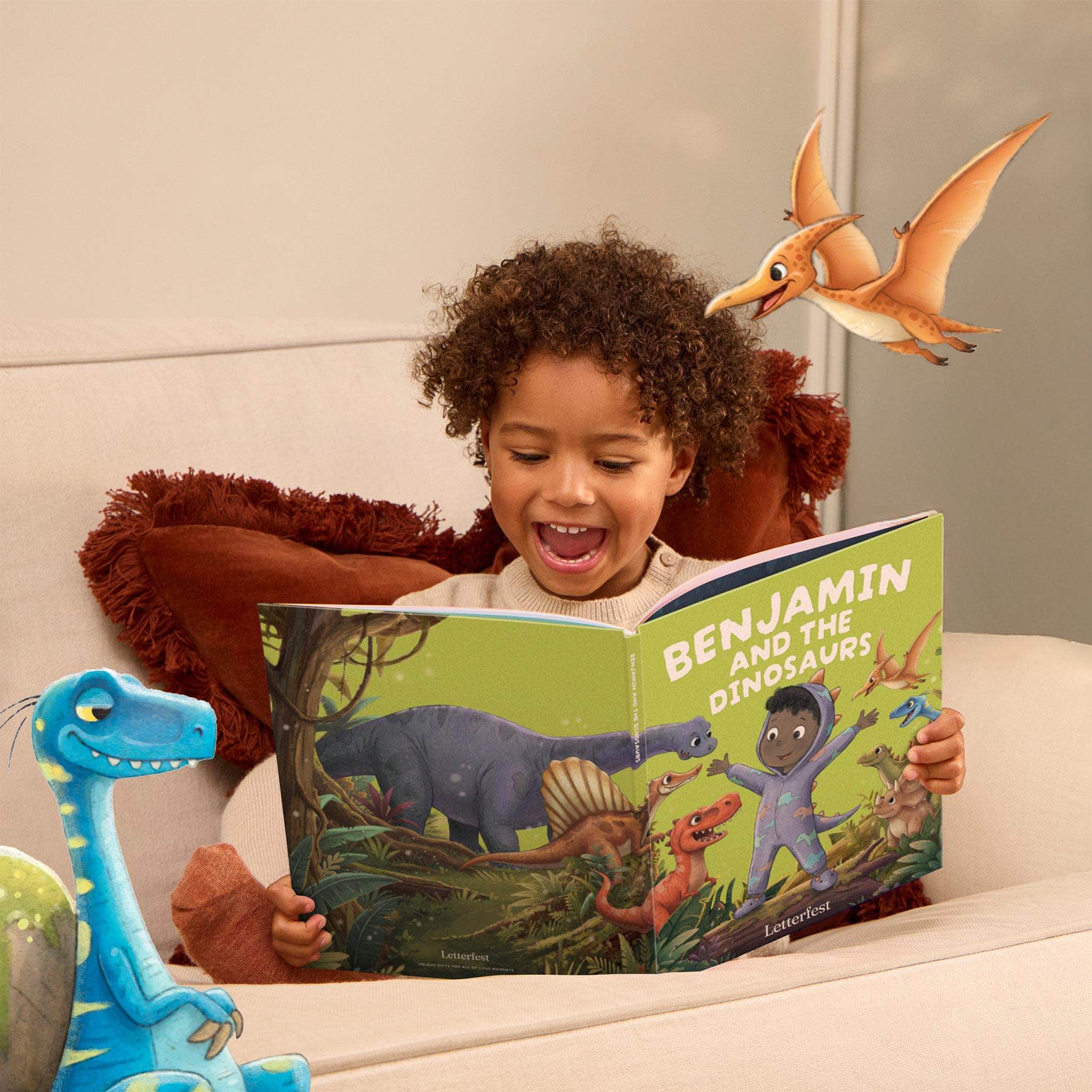 Child with dinosaur book